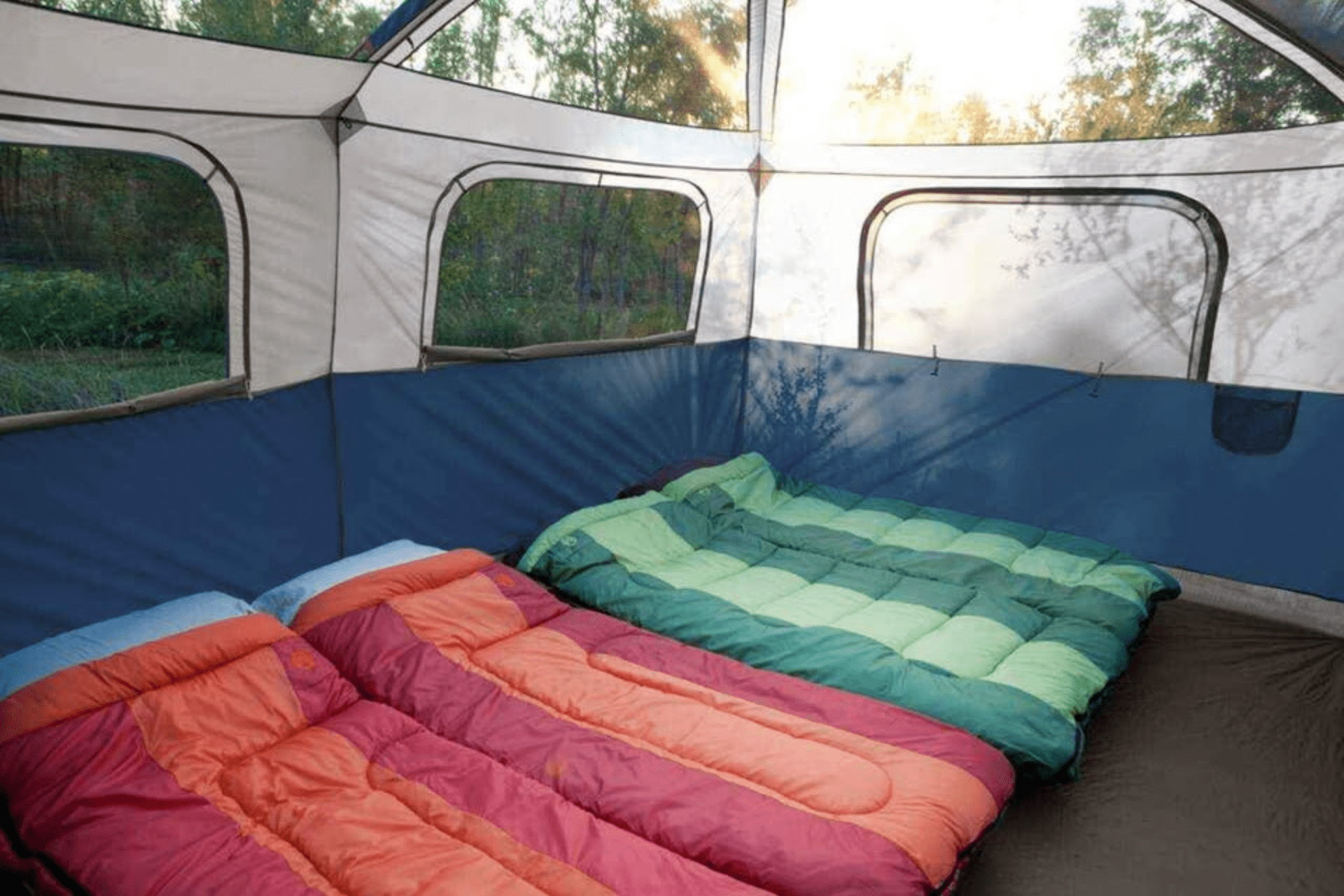 Spacious tent interior with room for three queen airbeds