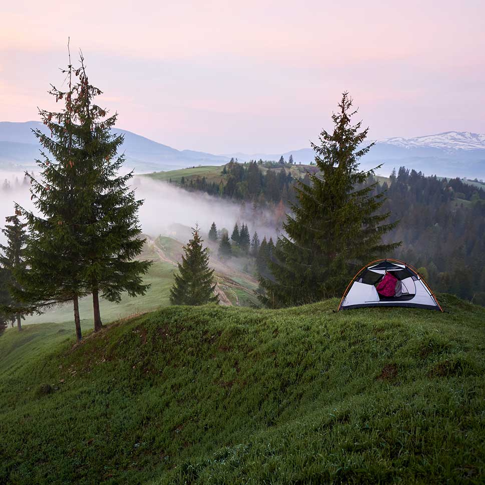 Campers enjoying tent rental experience in Kananaskis, Alberta