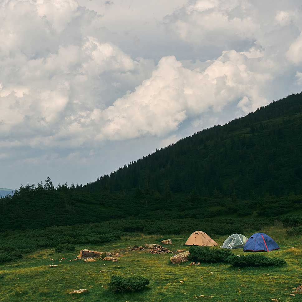 Campers enjoying tent rental experience in Kananaskis, Alberta