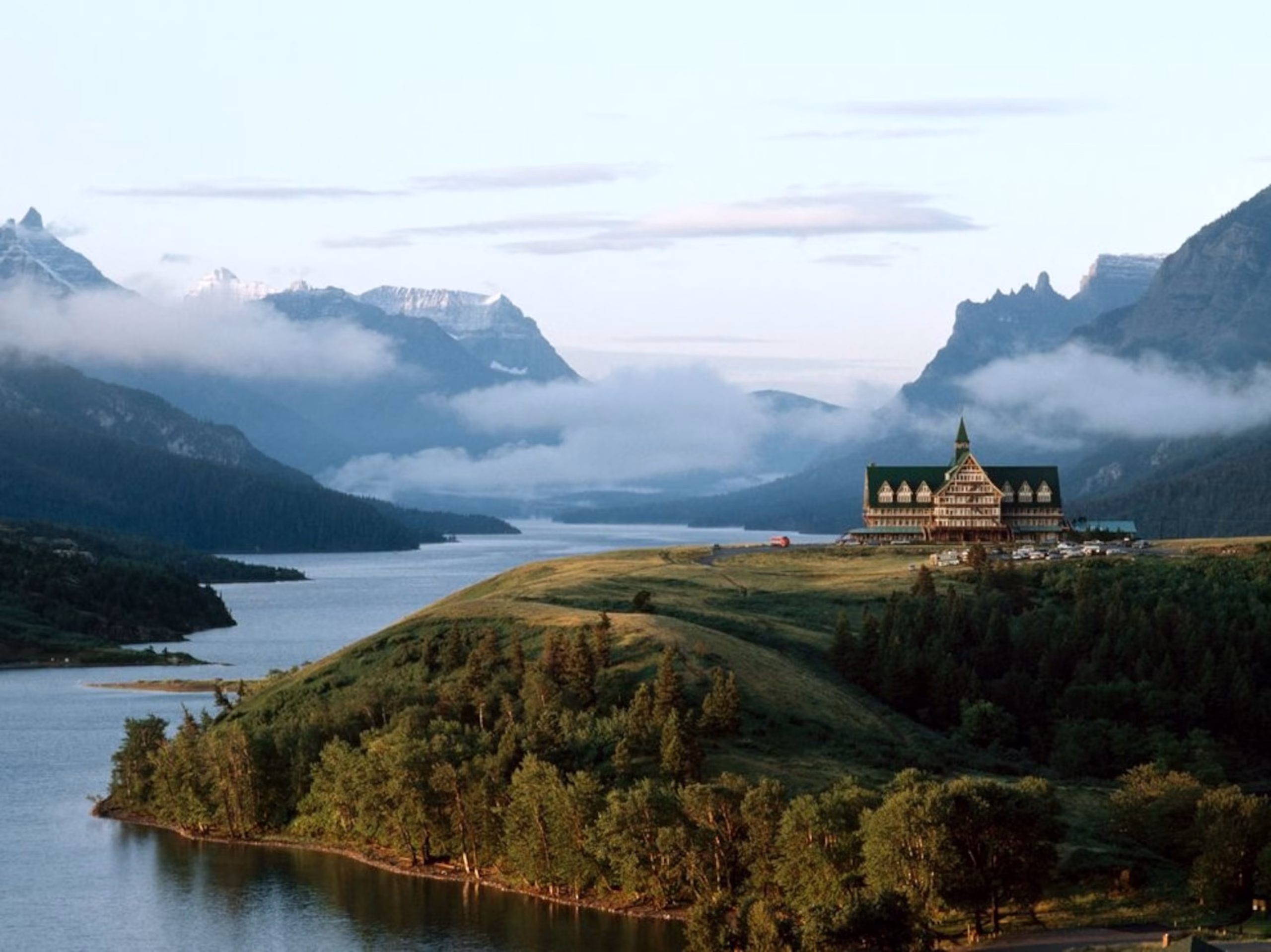 Waterton National Park camping scene with tent and lake backdrop