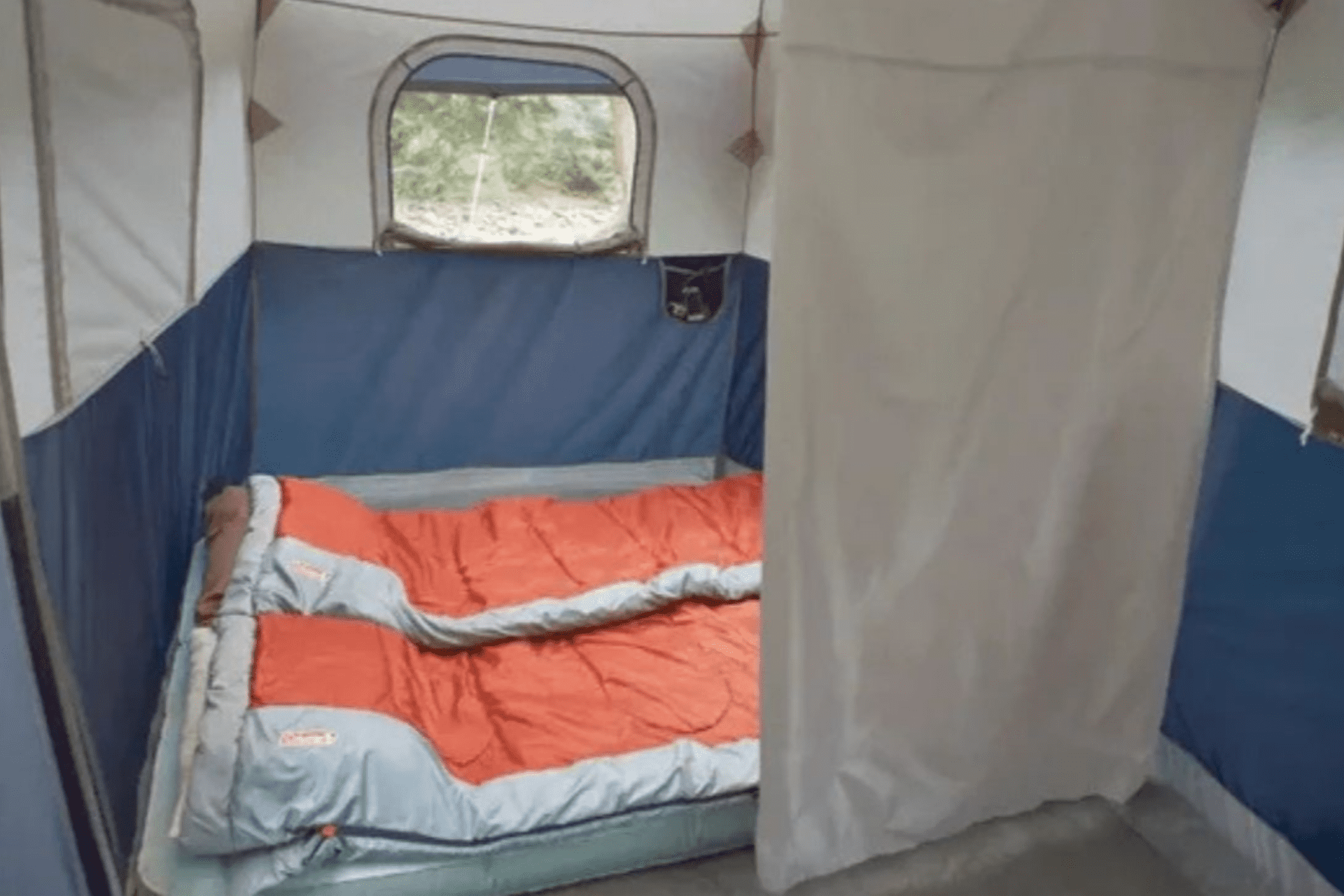 Campers setting up a large family tent near Calgary